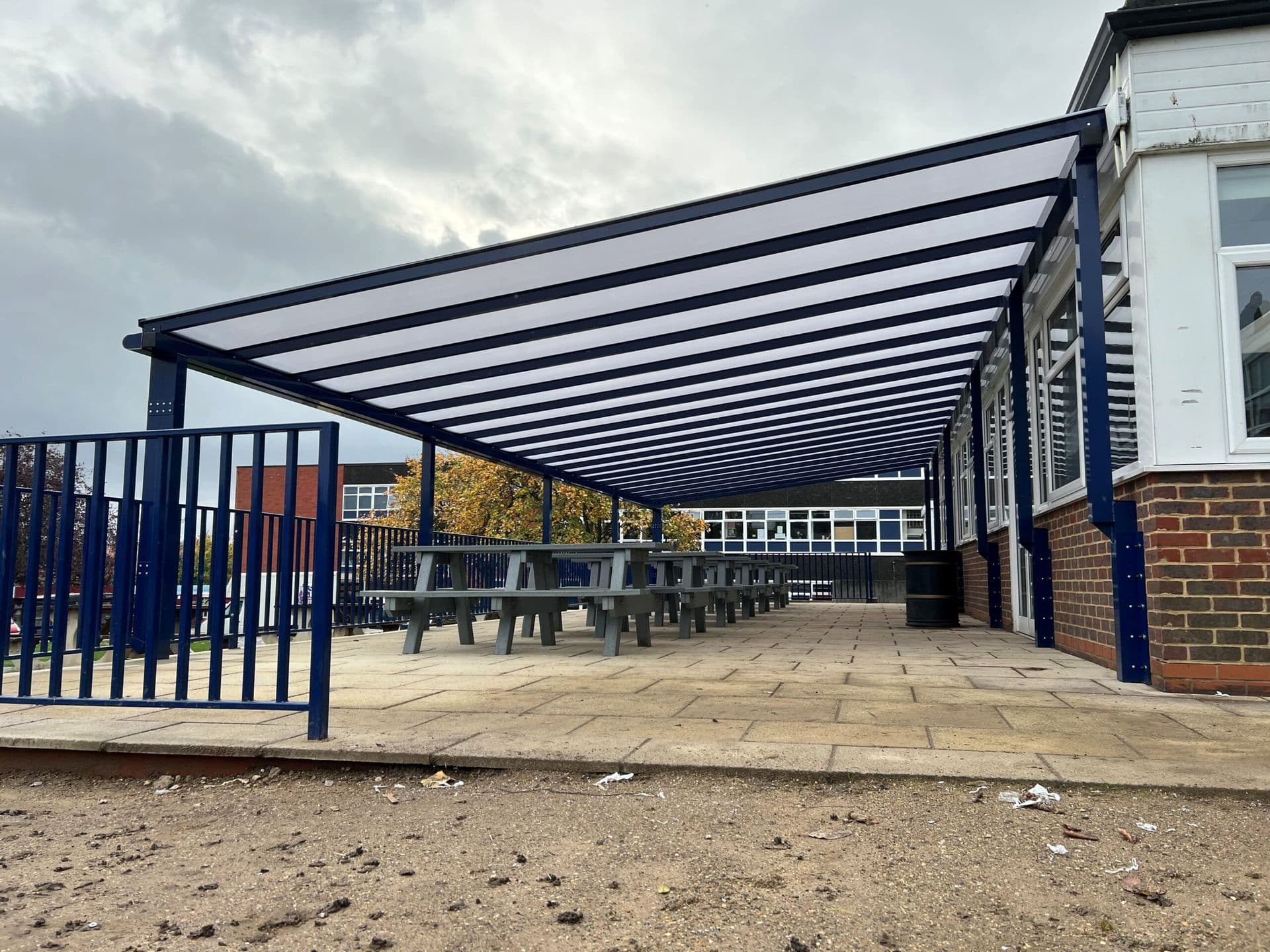 Large 16m monopitched canopy with a clear roof and dark blue frame, made by Alotek Shelters