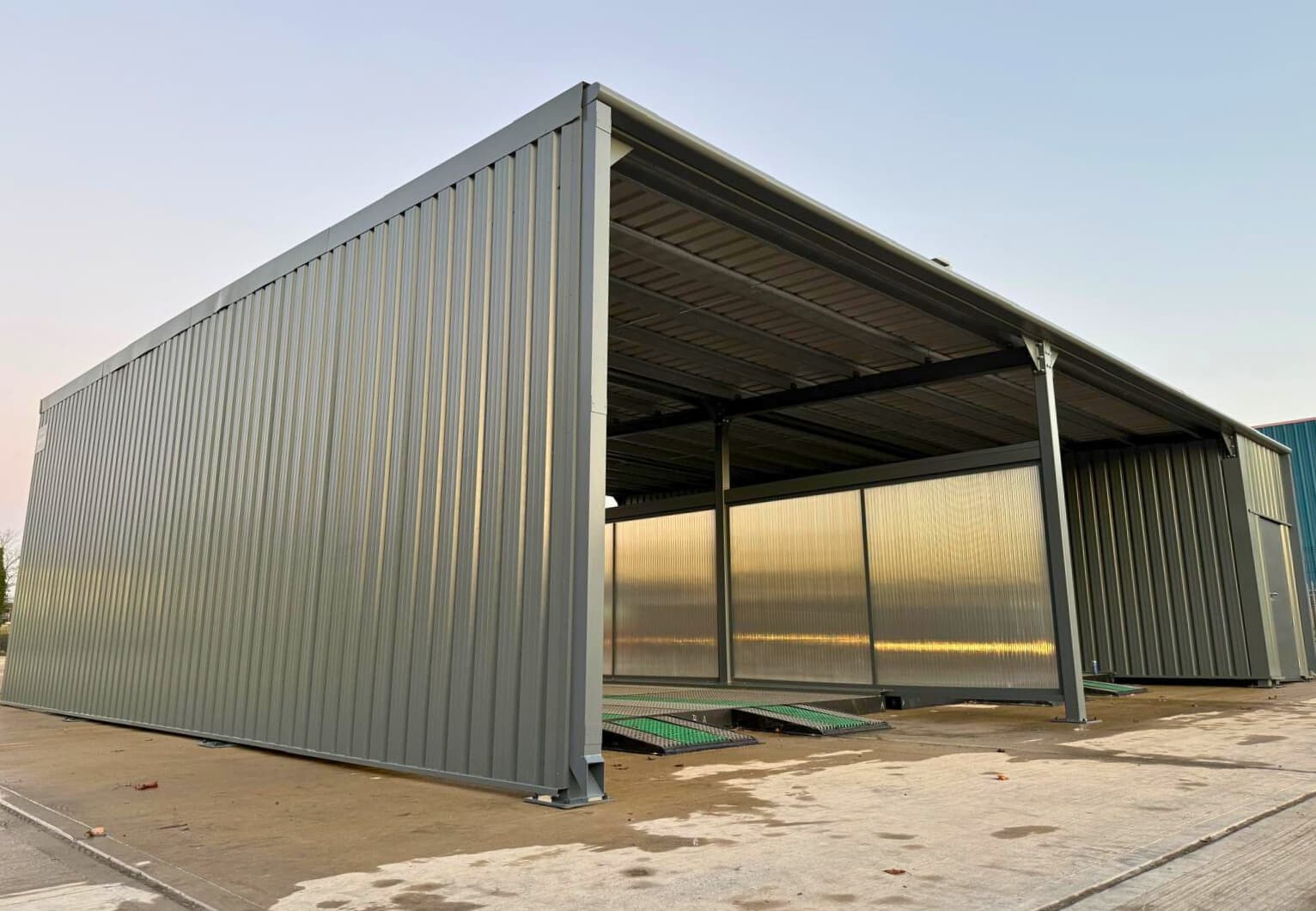 Jet wash enclosure for garage forecourt